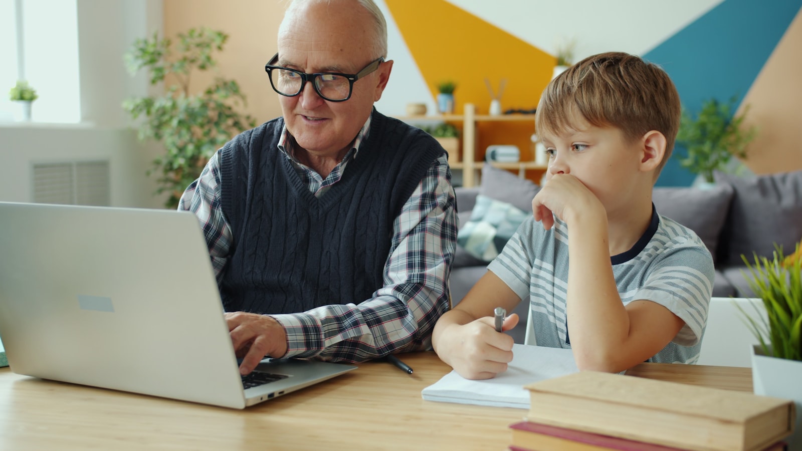 A learner being guided through a laptop session